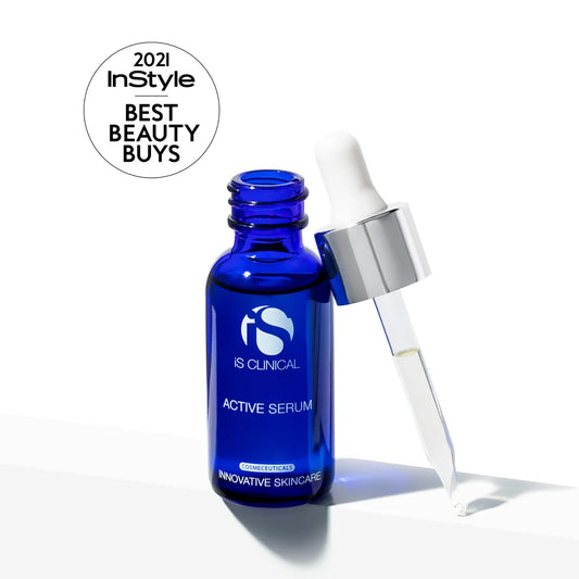Blue serum bottle with dropper labeled 'IS Clinical' on a white background, featuring '2021 InStyle Best Beauty Buys' badge.