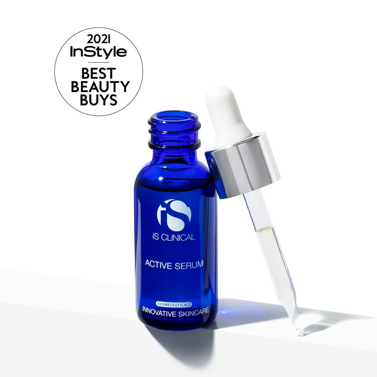 Blue serum bottle with dropper labeled 'IS Clinical' on a white background, featuring '2021 InStyle Best Beauty Buys' badge.
